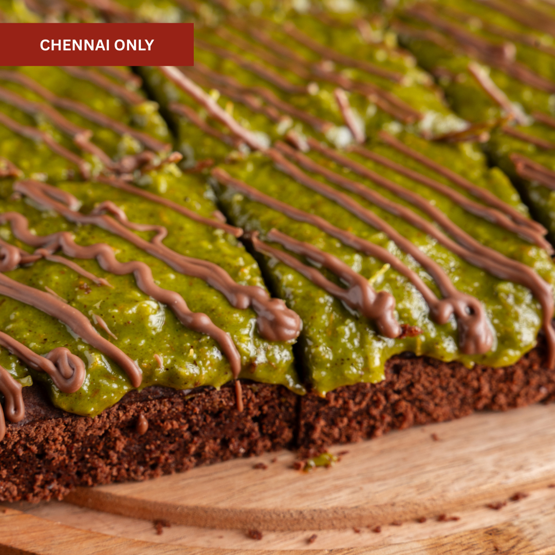 Crunchy kunafa brownie squares on a platter