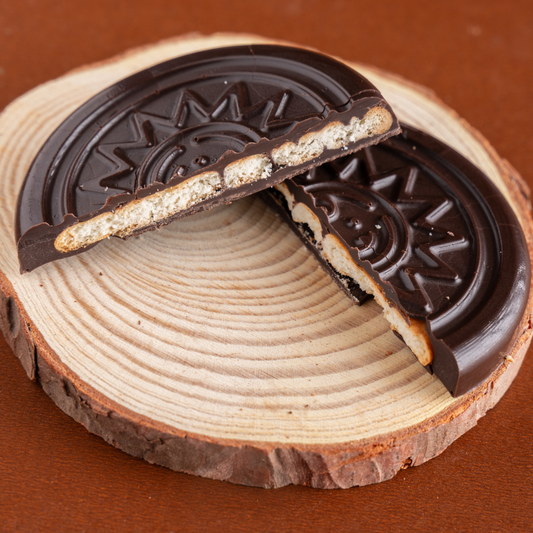 Chocolate-covered tea-time cookies stacked neatly