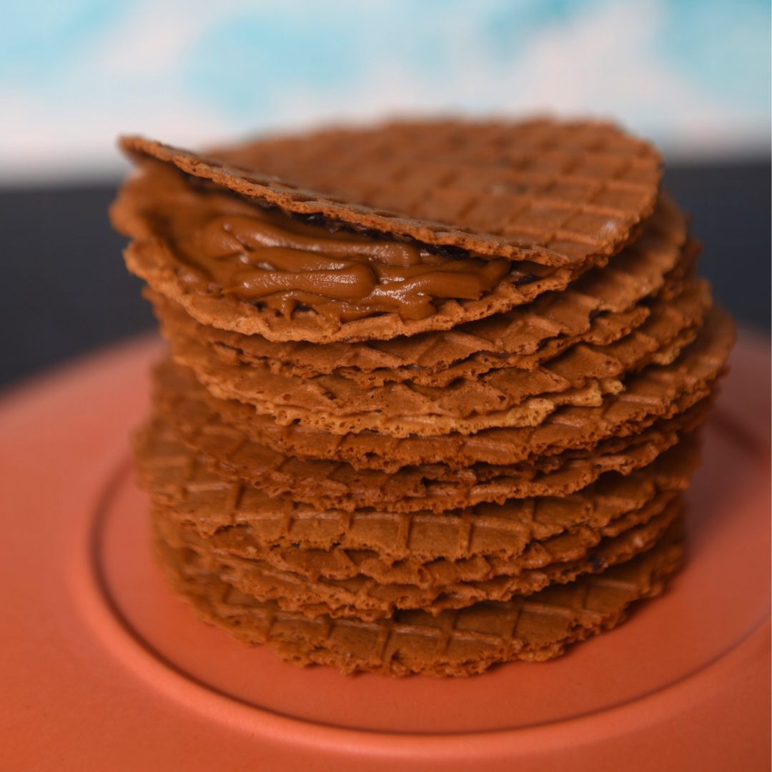 Crispy waffle thins paired with a cup of coffee for a delightful snack.