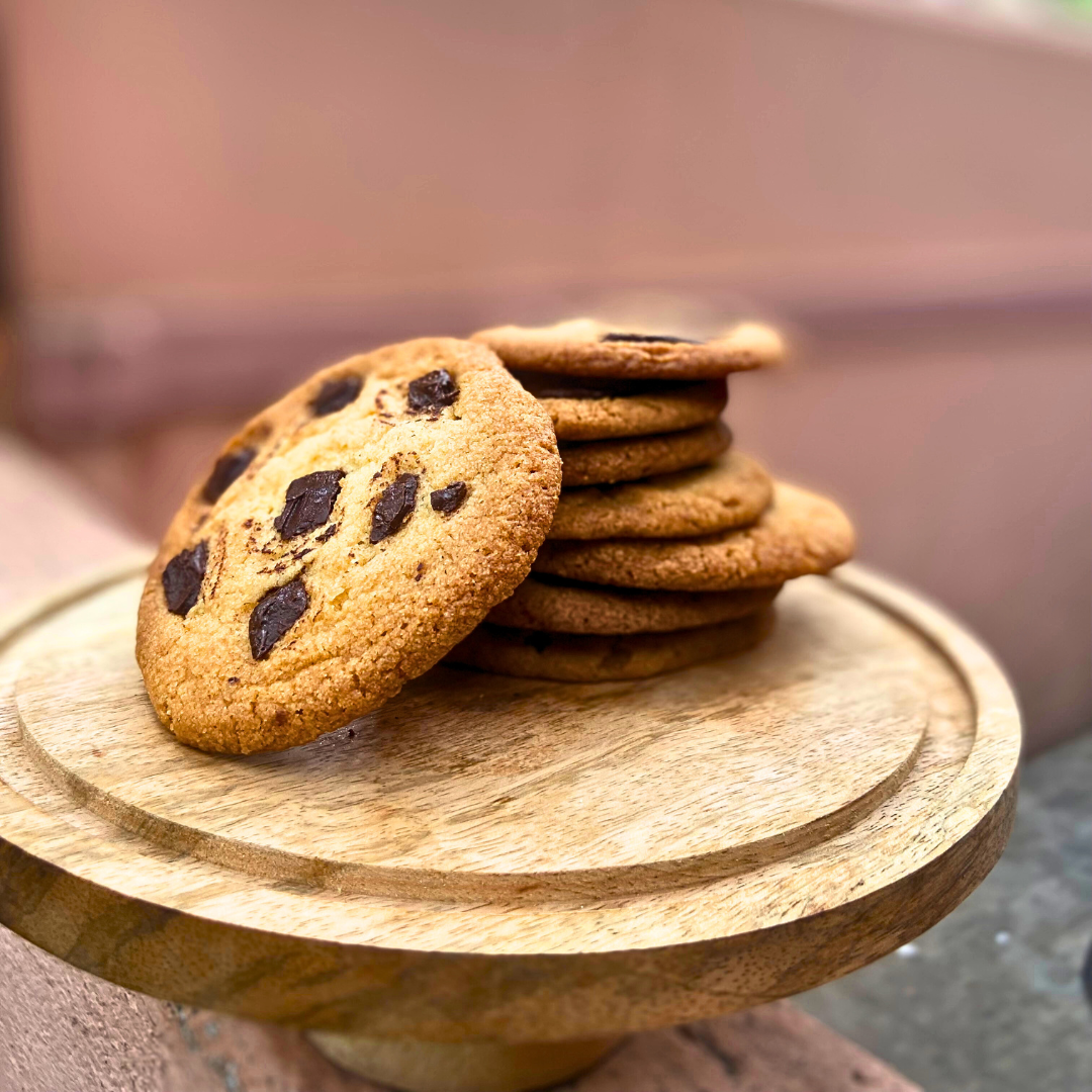 Freshly baked choco chip cookies with melted chocolate chunks.