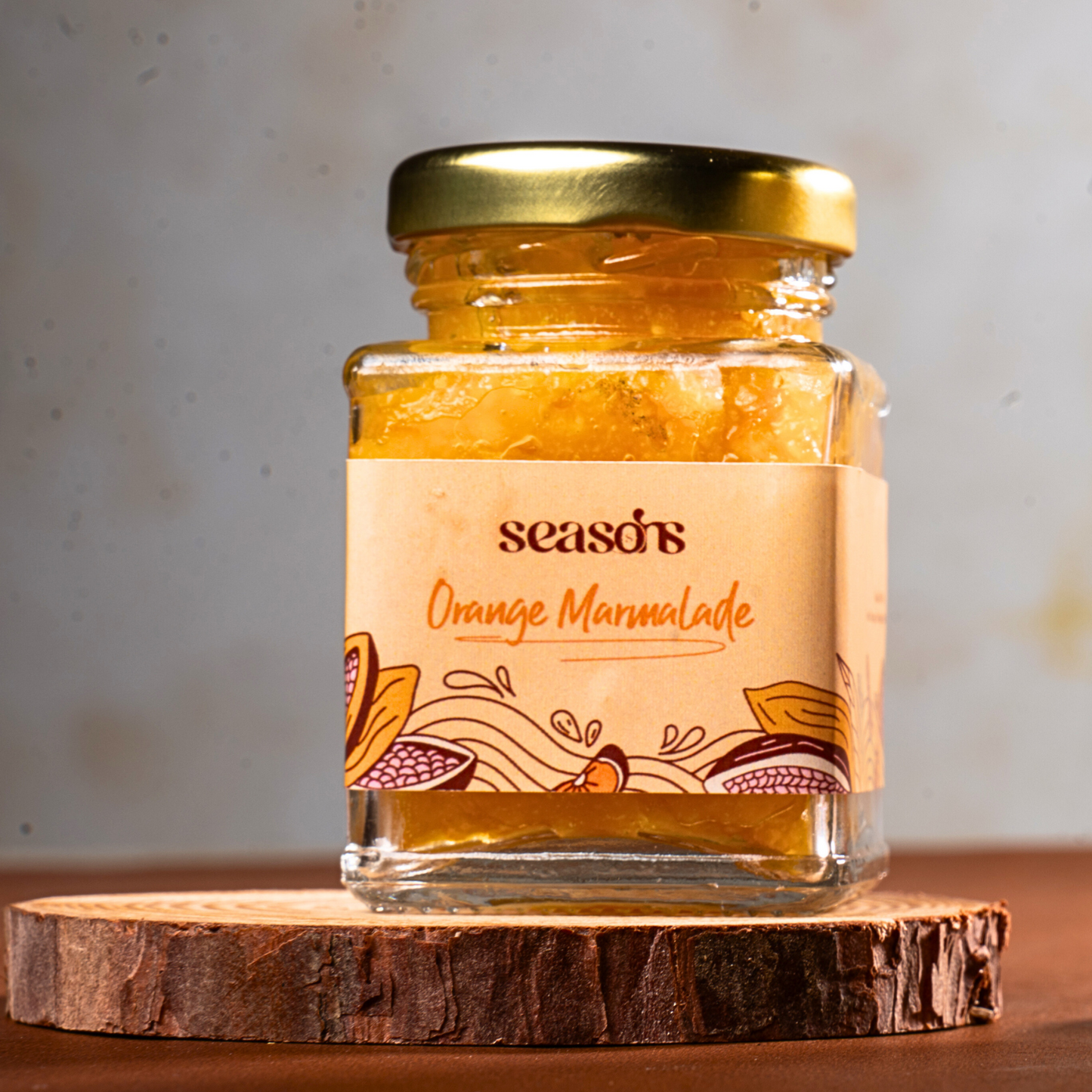Freshly made orange marmalade in an elegant jar, perfect for gifting.