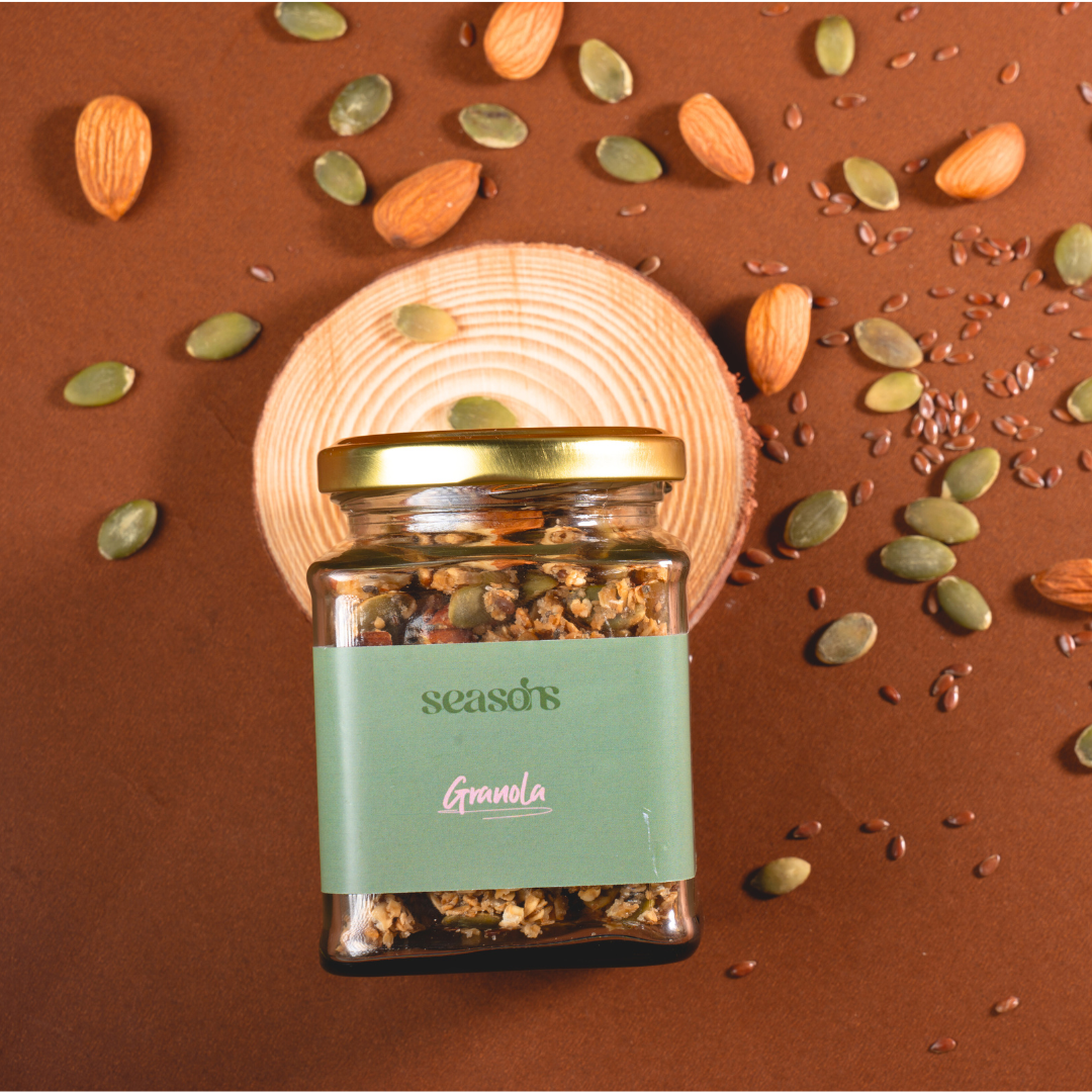 Granola jar packed with wholesome ingredients like nuts and dark chocolate.