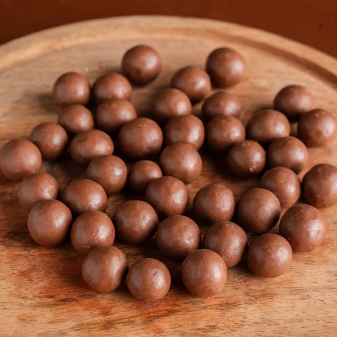 Chocolate-covered hazelnut sweets in elegant packaging